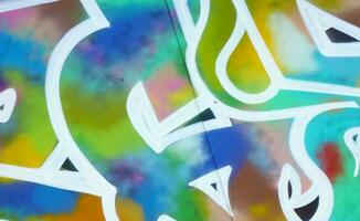 Colorful background of graffiti painting artwork with bright aerosol strips on metal wall photo