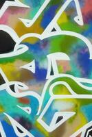 Colorful background of graffiti painting artwork with bright aerosol strips on metal wall photo