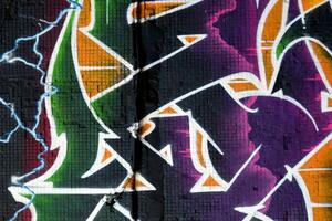 Colorful background of graffiti painting artwork with bright aerosol strips on metal wall photo