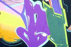 Colorful background of graffiti painting artwork with bright aerosol strips on metal wall photo