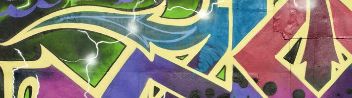 Colorful background of graffiti painting artwork with bright aerosol strips on metal wall photo