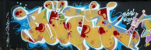 Colorful background of graffiti painting artwork with bright aerosol strips on metal wall photo