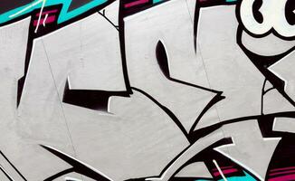 Colorful background of graffiti painting artwork with bright aerosol strips on metal wall photo