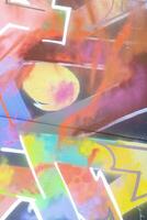 Colorful background of graffiti painting artwork with bright aerosol strips on metal wall photo