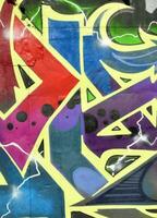 Colorful background of graffiti painting artwork with bright aerosol strips on metal wall photo