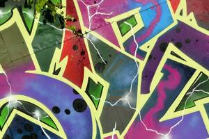 Colorful background of graffiti painting artwork with bright aerosol strips on metal wall photo