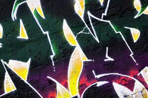 Colorful background of graffiti painting artwork with bright aerosol strips on metal wall photo