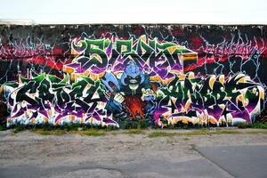 Colorful background of graffiti painting artwork with bright aerosol strips on metal wall photo