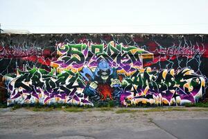 Colorful background of graffiti painting artwork with bright aerosol strips on metal wall photo