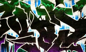 Colorful background of graffiti painting artwork with bright aerosol strips on metal wall photo