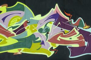 Colorful background of graffiti painting artwork with bright aerosol strips on metal wall photo