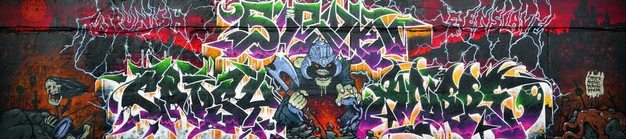 Colorful background of graffiti painting artwork with bright aerosol strips on metal wall photo