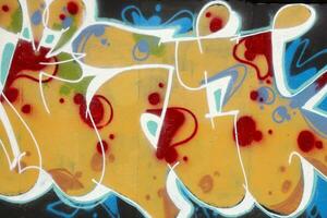 Colorful background of graffiti painting artwork with bright aerosol strips on metal wall photo