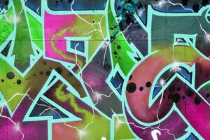 Colorful background of graffiti painting artwork with bright aerosol strips on metal wall photo