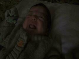 A 3 week old baby who is sleepy in his crib video