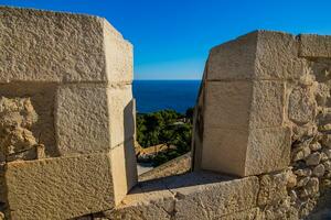 view from Saint Barbara's Castle in Alicante of the sea and the defensive wall photo