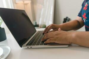 Businessperson using keyboard laptop computer job search, communication social networking, internet online Information, working data marketing concept. photo