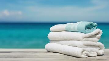 Seaside Luxury, White Beach Towels Gracefully Resting on Wood against a Blurred Blue Sea. Generative AI photo