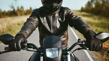 Unrecognizable biker in protective helmet and cozy leather jacket with hand gloves riding motorbike on sunny day in countryside, Generative AI photo