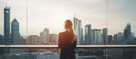 Business woman looks at the city of skyscrapers from the office, view from the back, unrecognizable face. Generative AI photo