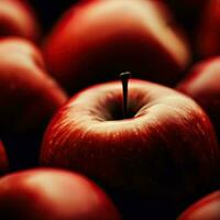 un de cerca de un rojo manzana con agua gotas en eso generativo ai foto