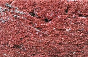 brick wall of red color, Old, beginning to collapse, carelessly laid brickwork, Background. Vintage brick old brickwork Texture. Carelessly made brickwork. Excess cement, broken brick. pattern texture photo