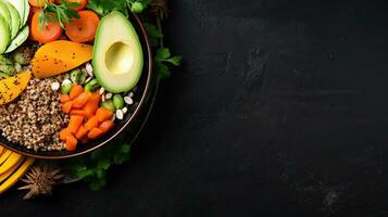 Red quinoa bowl with avocado, radishes, scallions, cherry tomatoes, chives and fresh basil. Top view. Copy space. photo