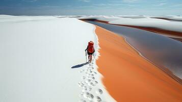 Tourists walking on desert sand dunes with red river aerial view at sunset,Generated with AI photo