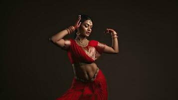 Beautiful Indian girl Hindu female model in sari and kundan accessories red traditional costume of india photo