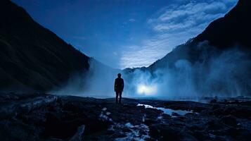 Tourists, mountain climbers, stand as the clouds enter the valley. photo