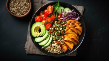 Red quinoa bowl with avocado, radishes, scallions, cherry tomatoes, chives and fresh basil. Top view. Copy space. photo