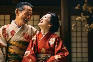 Portrait of a young couple in yukata standing together under the cherry blossom tree. photo