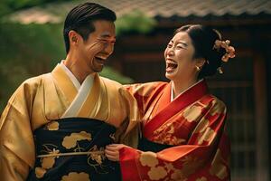 Portrait of a young couple in yukata standing together under the cherry blossom tree. photo