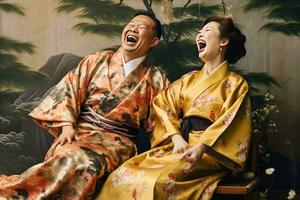 Portrait of a young couple in yukata standing together under the cherry blossom tree. photo