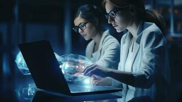 Two female scientists are using laptops in the laboratory. photo