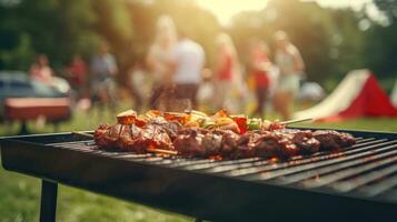 Family group partying outdoors Focus on grilling food in public gardens. space for text photo