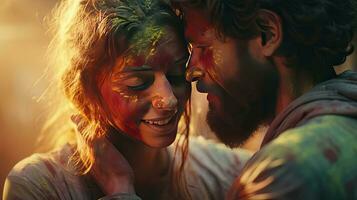 Happy couple puts paint on their faces during Holi celebration. indian holi festival photo