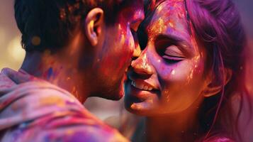 Happy couple puts paint on their faces during Holi celebration. indian holi festival photo