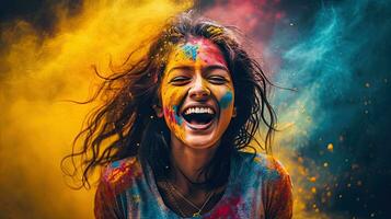 Beautiful happy Indian woman celebrates Holi with colored powder or gulal. indian festival holi photo