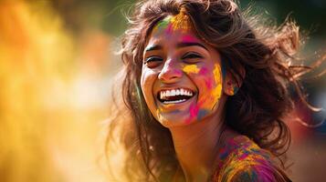 Beautiful happy Indian woman celebrates Holi with colored powder or gulal. indian festival holi photo