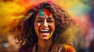 Beautiful happy Indian woman celebrates Holi with colored powder or gulal. indian festival holi photo