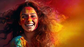 Beautiful happy Indian woman celebrates Holi with colored powder or gulal. indian festival holi photo