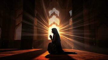 Religious Muslim woman praying in a church photo