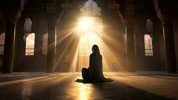 Religious Muslim woman praying in a church photo