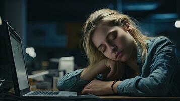 Young woman falls asleep at work photo
