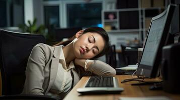 Young woman falls asleep at work photo