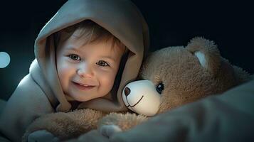 A cute little boy hugs a big soft teddy bear. photo