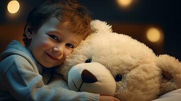 A cute little boy hugs a big soft teddy bear. photo