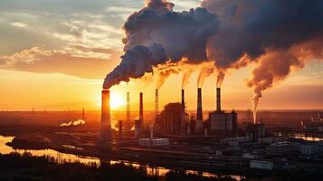 Chemical factory with smokestack Smoke from factory pipes at sunset, ecological problems and air pollution photo