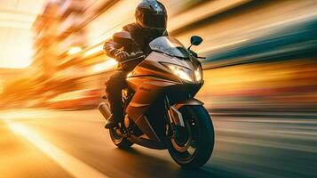 Motorcyclist with helmet at high speed, blurred lights, city road photo